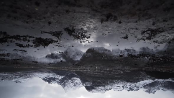 Snow Covered Mountains Reflected In Fjord