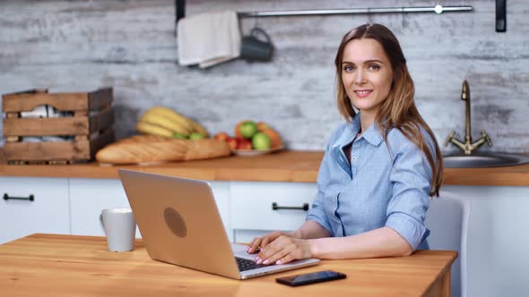 Portrait Beautiful Female Posing Sit in Front of Notebook at Cuisine Interior