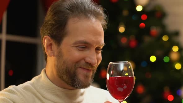 Young Couple Drinking Wine at Christmas, Romance and Festive Mood, Closeup