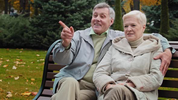 Elderly Happy Family Couple Caucasian Woman Man Sit on Bench Together in Autumn Park Married Senior