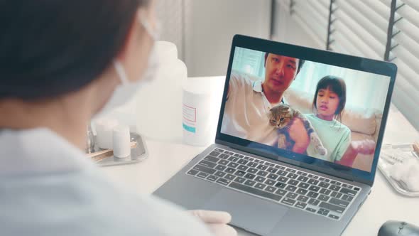 Asian veterinarian girl talk to pet owner on online virtual video call.