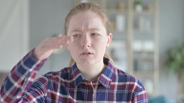 Close Up of Young Woman Looking for Something