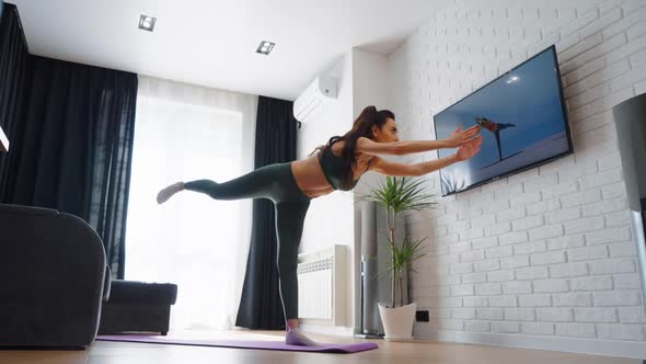 Yoga Woman Balancing on One Leg