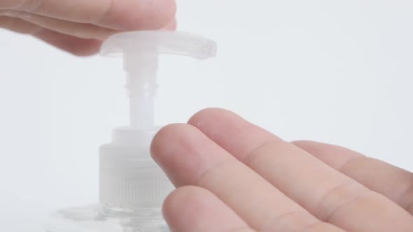 Pump of  sanitizer gel  plastic bottle  slow-mo close-up footage
