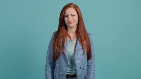 Close Up of a Puzzled Young Woman Expressing Doubting, Hesitating Emotion.