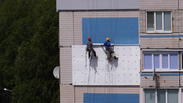 Two Industrial Climber, Insulation Facade of High-rise Building Using Styrofoam