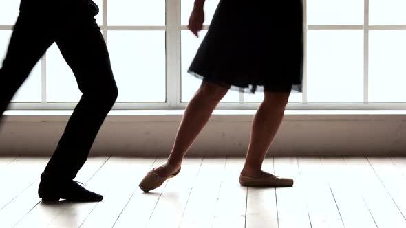 Legs of Dancers Working Out in Ballet Studio