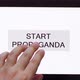 Hand presses the START PROPAGANDA button on the touch screen. - VideoHive Item for Sale