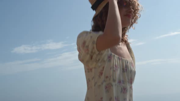 Cute Girl Frolicing Jumping on Seashore Summer Day Close Up