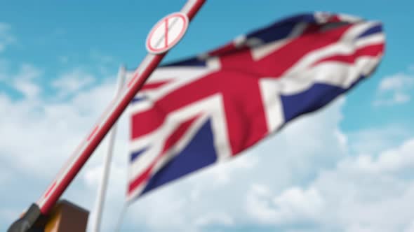 Barrier Gate with No Immigration Sign Being Closed Near Flag of UK alt