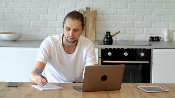 Pleasant happy man communicating in social network, searching information online
