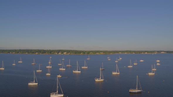 Forward Aerial Pan of Sail Boats Anchored at Bay in Port Washington Long Island