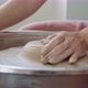 Female Potter Sitting and Makes a Cup on the Pottery Wheel. Woman Making Ceramic Item. Pottery - VideoHive Item for Sale