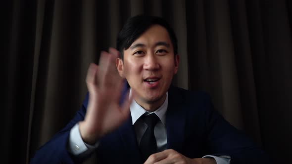Young Asian Business Man Speaking on the Video Call Conference
