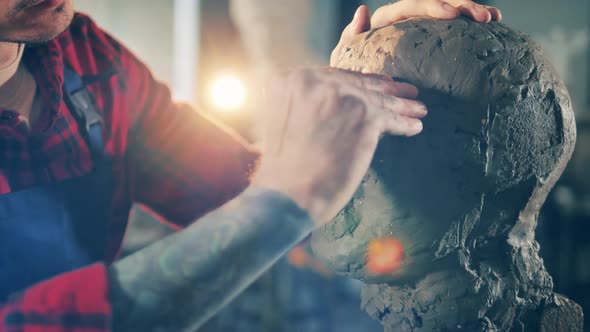 Close Up of a Clay Sculpture While Getting Molded By an Artist