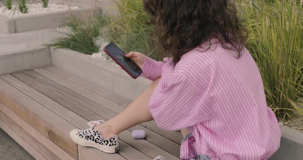 Businesswoman using smartphone Close Up. Businesswoman texting on a phone touchscreen.