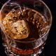 Slow Motion Shoot On Ice Cube Dropping Into The Whiskey - VideoHive Item for Sale