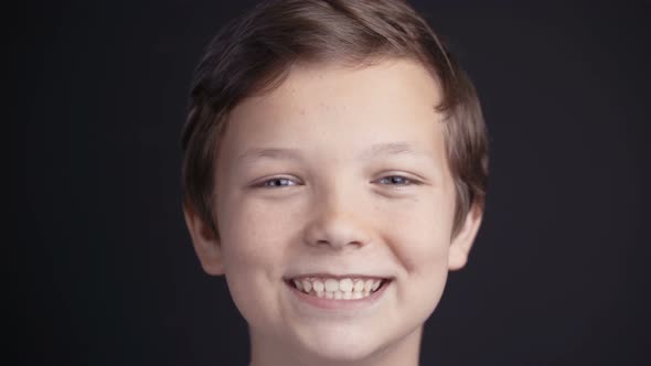 Portrait of Boy Looking the Camera and Laughing