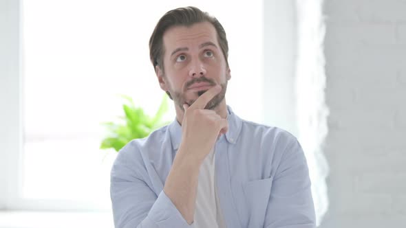 Portrait of Pensive Young Man Thinking New Plan