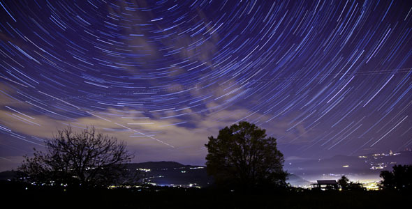 Night Cloudy Sky with Star Trails 