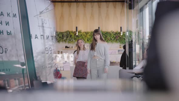 Three Beautiful Young Women Came to a Meeting in a Cafe