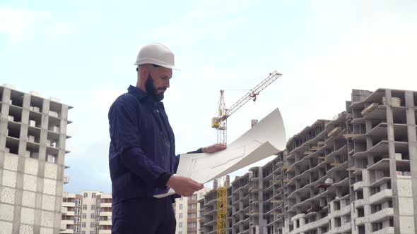 Portrait of a Successful Young Engineer Architect Builder Businessman Wearing a White Helmet in a