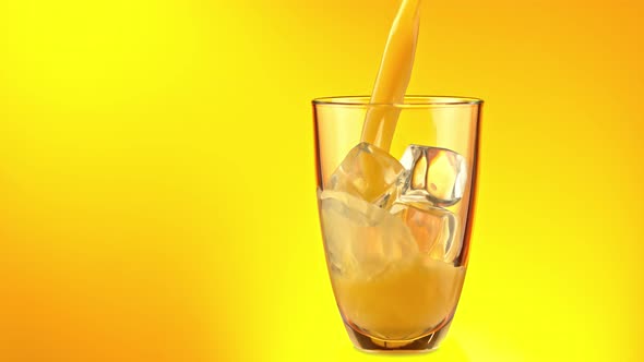 Super Slow Motion Shot of Pouring Fresh Orange Juice Into Glass with Ice Cubes at 1000 Fps