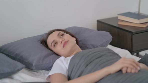 Woman Awake in Bed Thinking