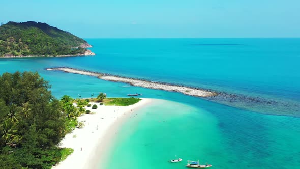 Aerial seascape of relaxing coastline beach break by shallow sea and white sand background of advent