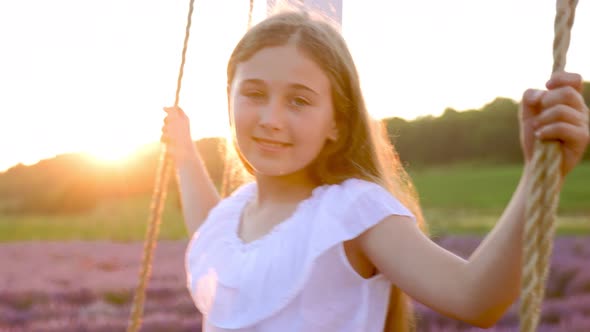 Girl Riding a Swing