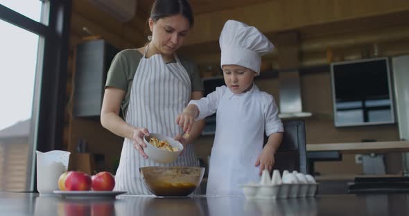 Mom Teaches Her Son to Cook Apple Pie