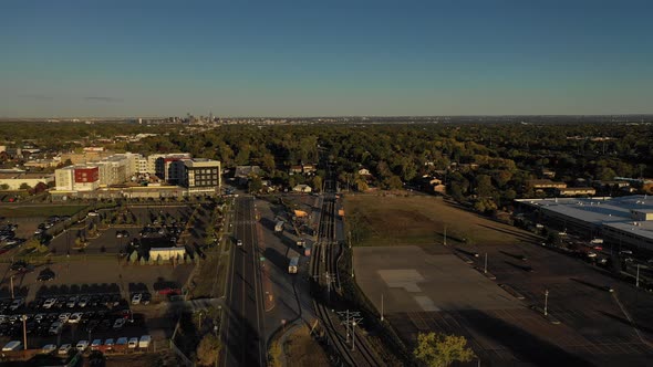 An evening capture of rail lines and roads located in a Denver suburb