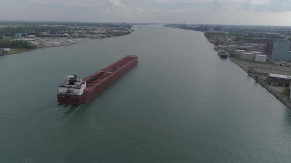 This video is of an aerial of large tanker ships in the Detroit river near downtown Detroit.