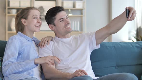 Young Couple Taking Selfie with Smartphone