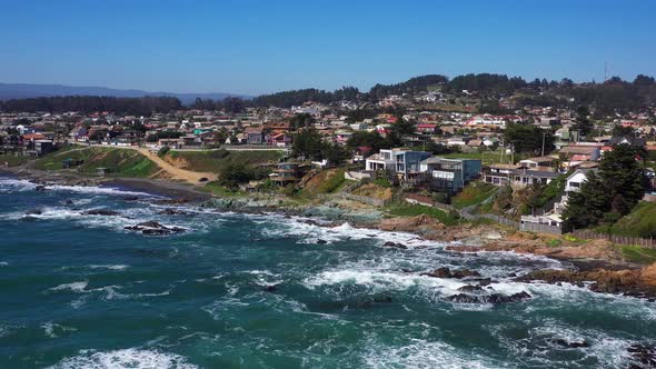 aerial: view of infiernillo surf beach in the city of pichilemu, chile 