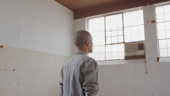 Fashionable young man in an abandoned warehouse