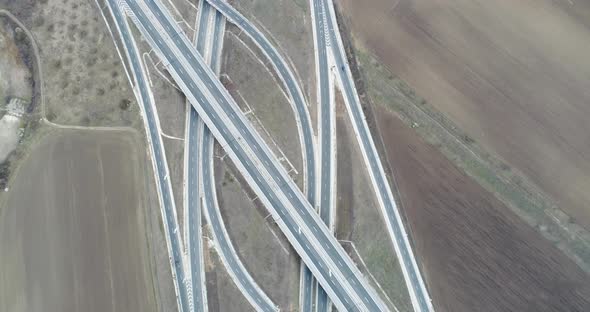 Aerial view of highway and overpass. Road junction, highway intersection top view.