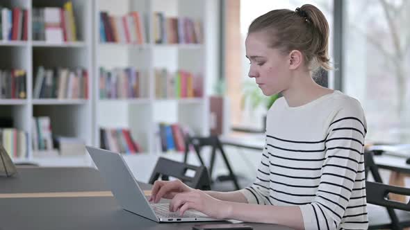 Young Woman with Laptop Standing and Going Away