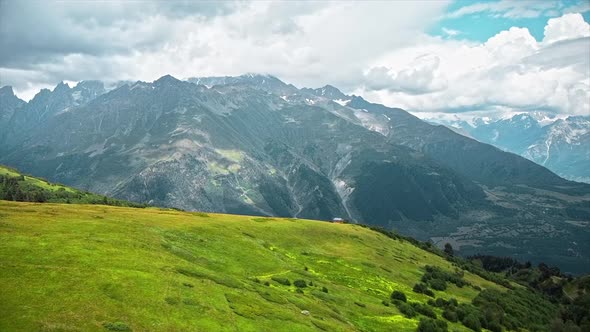 Aerial drone view of nature in Georgia. Caucasus Mountains, greenery, valleys, lush clouds