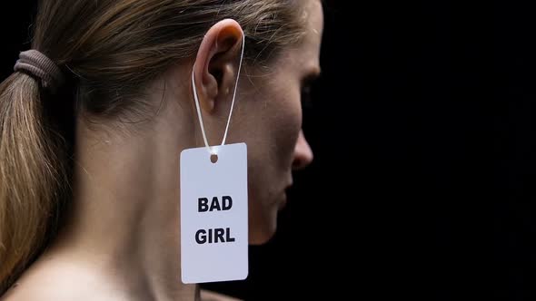 Lady Tearing Bad Girl Label From Ear, Protest Against Shaming and Labeling