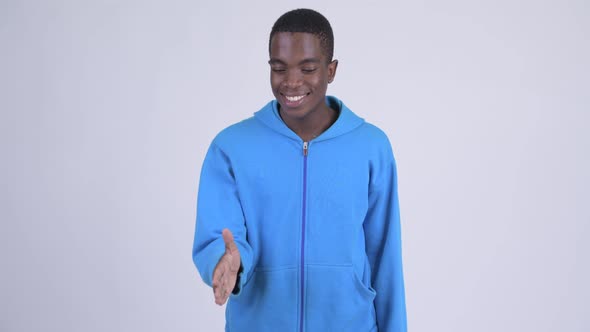 Young Happy African Man Giving Handshake