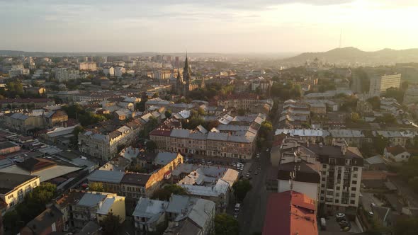 Flight on a Fabulous City at Sunrise. Morning in the Small Town of Lviv in Ukraine. The Sun's Rays