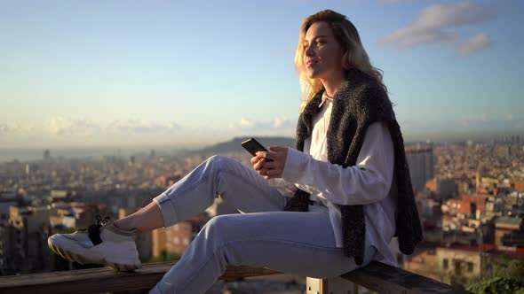 Woman writing text message on smartphone