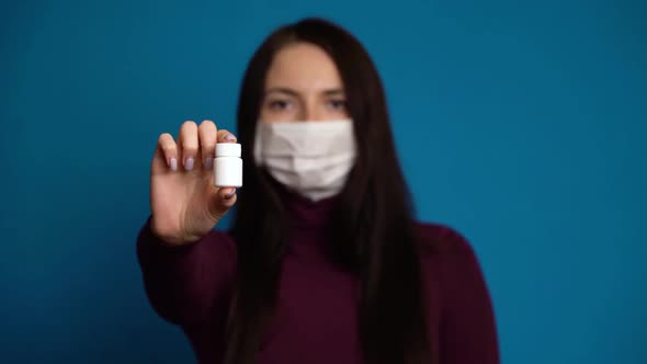 Woman Presenting a Hand Pills