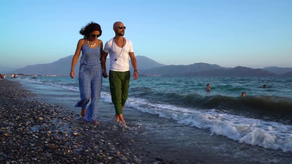 Happy Couple On The Beach