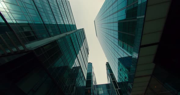 Blue Sky and Clouds are Reflected on the Facades of Skyscrapers Timelapse