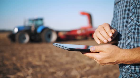 Farmer Using Digital Tablet