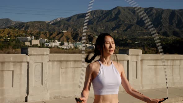 Attractive asian woman doing her morning exercises