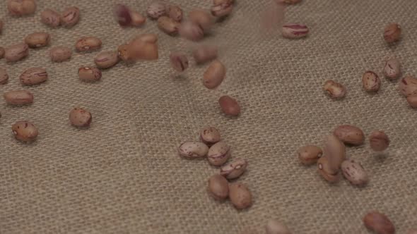 Dry beans borlotti legumes falling at slow motion. Vegan vegetarian food Mediterranean diet nutritio