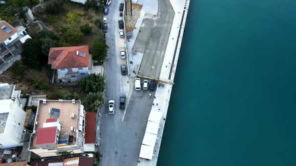 Car Moving By Small Greece City at Seaside